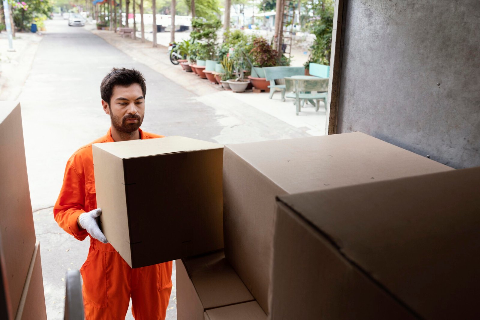 delivery-man-loading-car-with-delivery-boxes